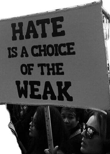 Pro-democracy community. Protest sign that says hate is a choice of the weak. It’s