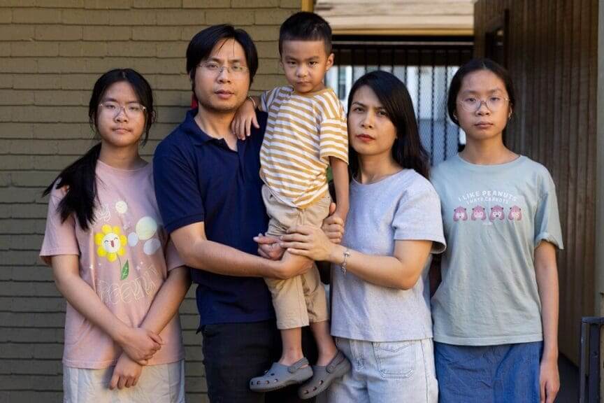 Family of 5 stand side by side