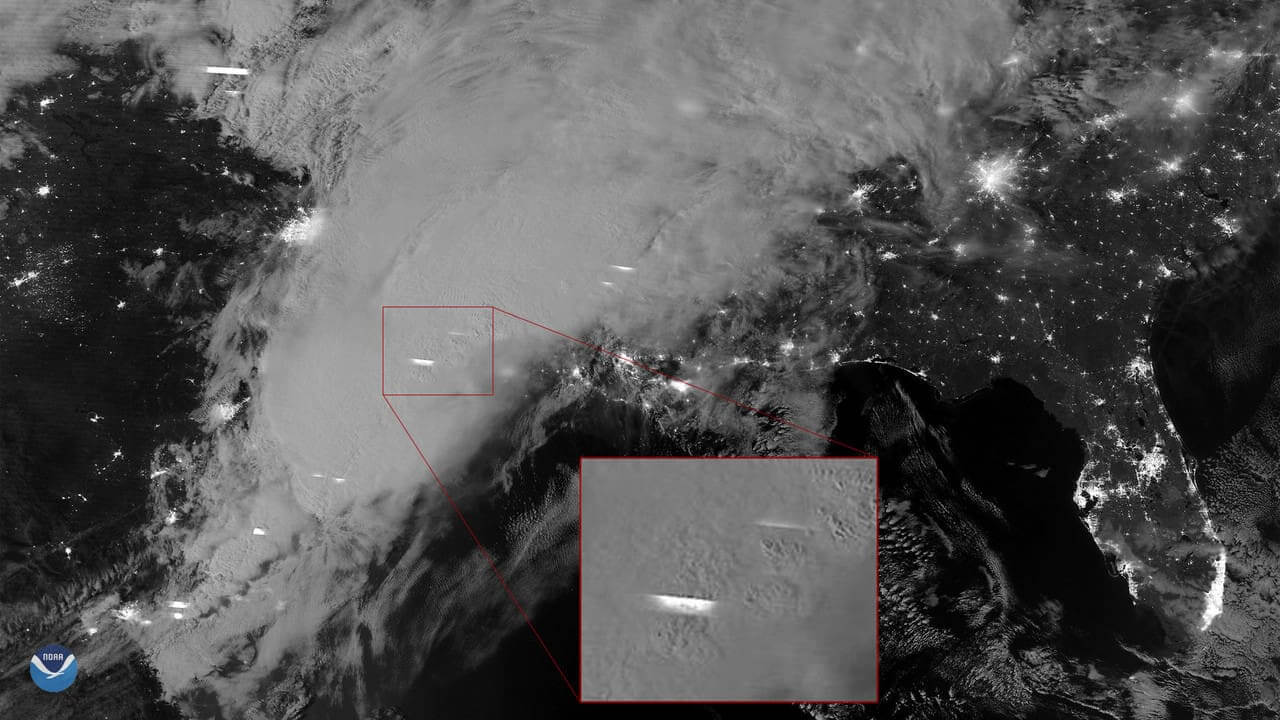 Noaa satellite image of storms at night.