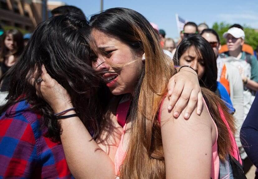 Undocumented immigrant population was unaffected by obamas deportations. A woman crying on a friend’s shoulder during an obama protest.