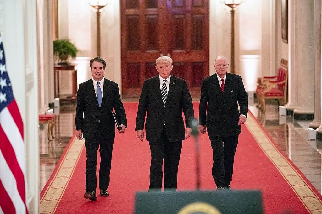 Trump walking with brett kavanaugh and a retired justice