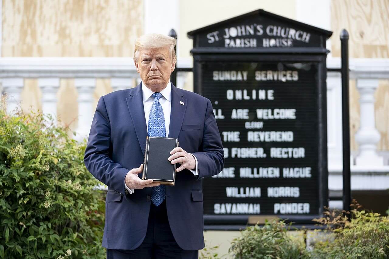 President trump posing with the upside-down bible