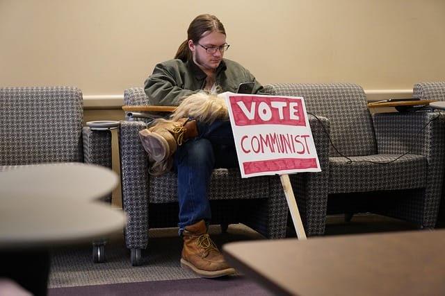 Communist marxist socialist man with a vote communist sign