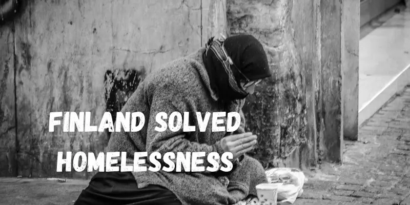 Black and white photo of a homeless woman