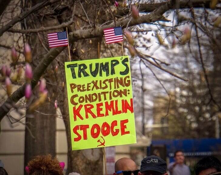 Obamacare premiums. ACA rally in DC protest sign