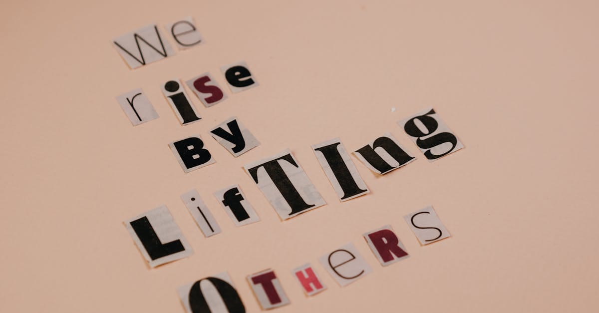 Cutout letters forming an inspirational quote on a beige background, encouraging positivity.