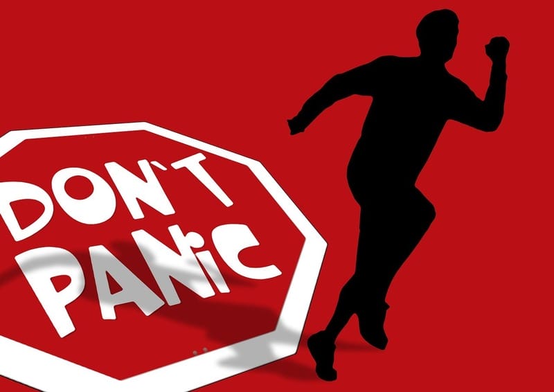 running dont panic Don’t panic sign and silhouette of a person running.