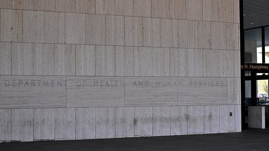 HHS engraving on the wall of the building in DC