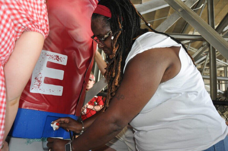 cooling station1 Woman getting water from a cooling station in a football stadium