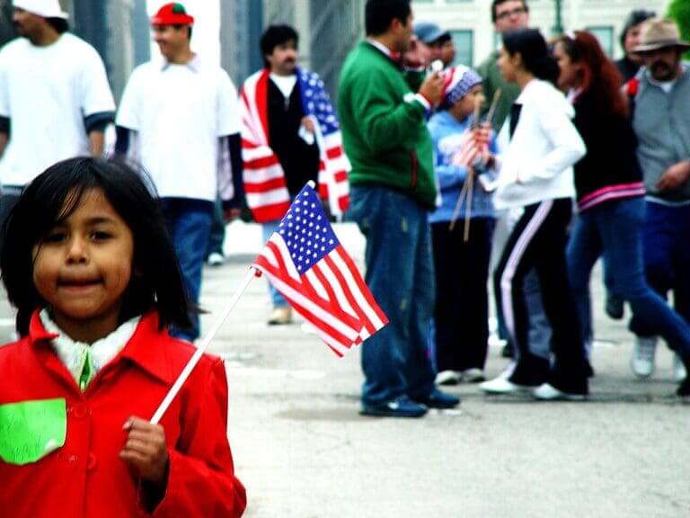 Cbp agents are back in Chicago. A little girl holding an American flag at a 2006 immigration protest in Chicago