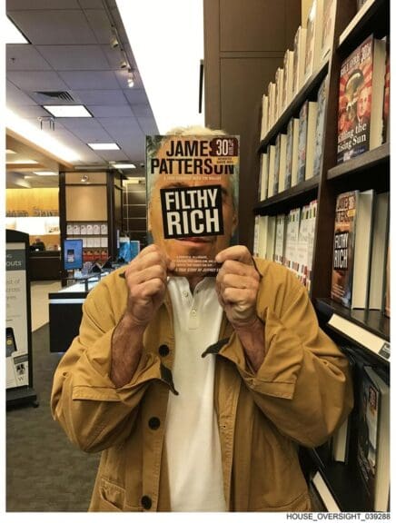 epstein photo book Epstein holding his book in front of his face