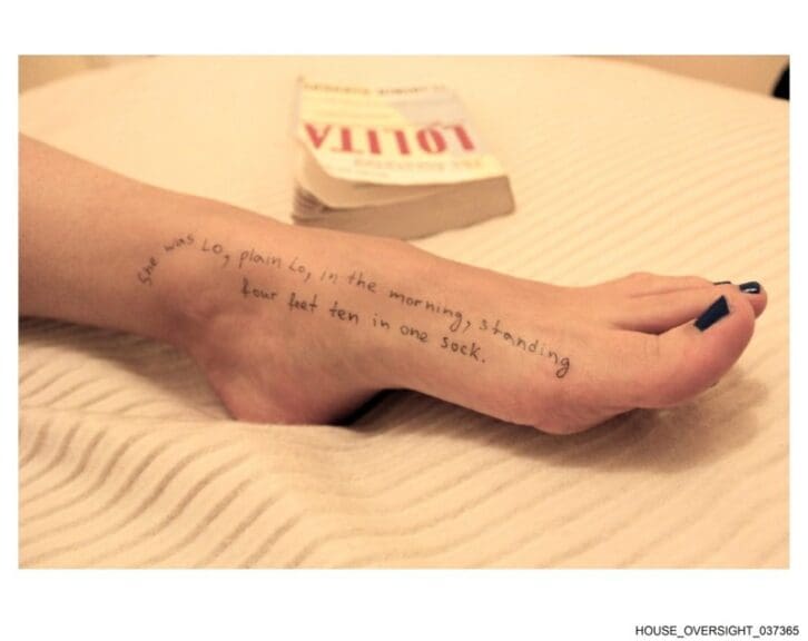 Girl’s foot with writing on it next to a copy of the book lolita new epstein photos