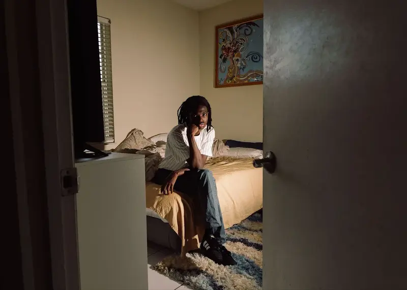 Man sitting on a bed