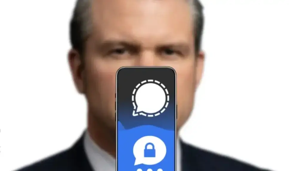 Pete Hegseth blurry with a cell phone displaying the Signal app logo in front of him. Hegseth quoted pulp fiction.