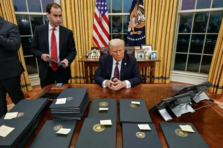 Trump surrounded by executive orders
