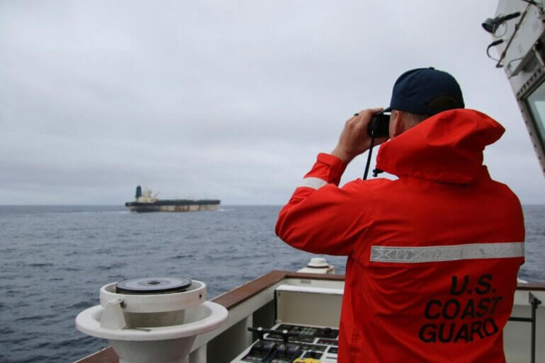 A member of the US Coastguard tracks the Marinera, a ship sailing in the Atlantic under a Russian flag. EUCOM.