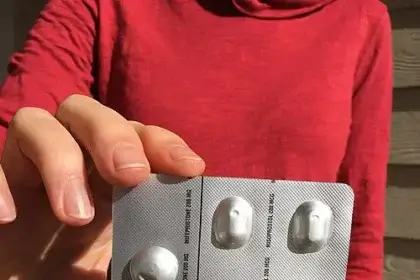Hand holding abortion pills women's rights