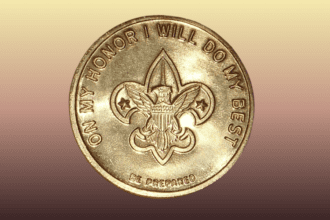 Gold coin with boy scouts logo and pledge