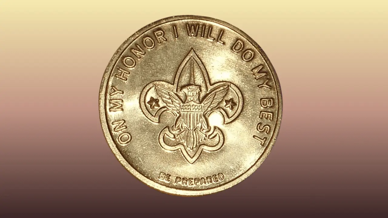 Gold coin with boy scouts logo and pledge