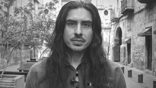 pyramid of power author Derrick broze portrait