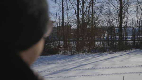 woman interviewed back Woman who lives near xai