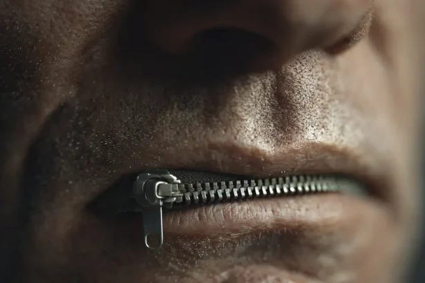 Florida censorship. Man with mouth zipped shut