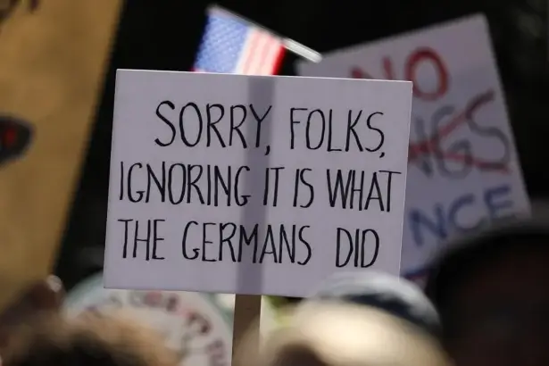 No kings III protest sign about Nazi Germany