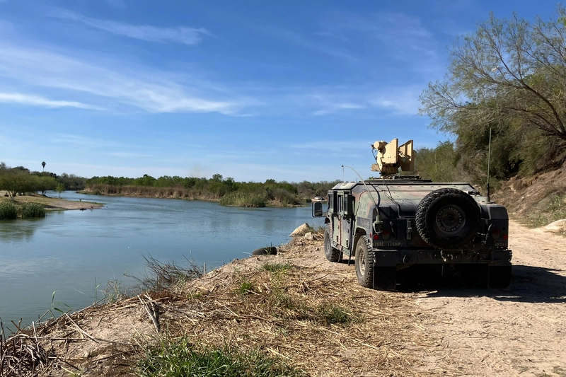 vehicle parked along rio grande Humvee is seen parked on the banks of the rio grande in roma, texas