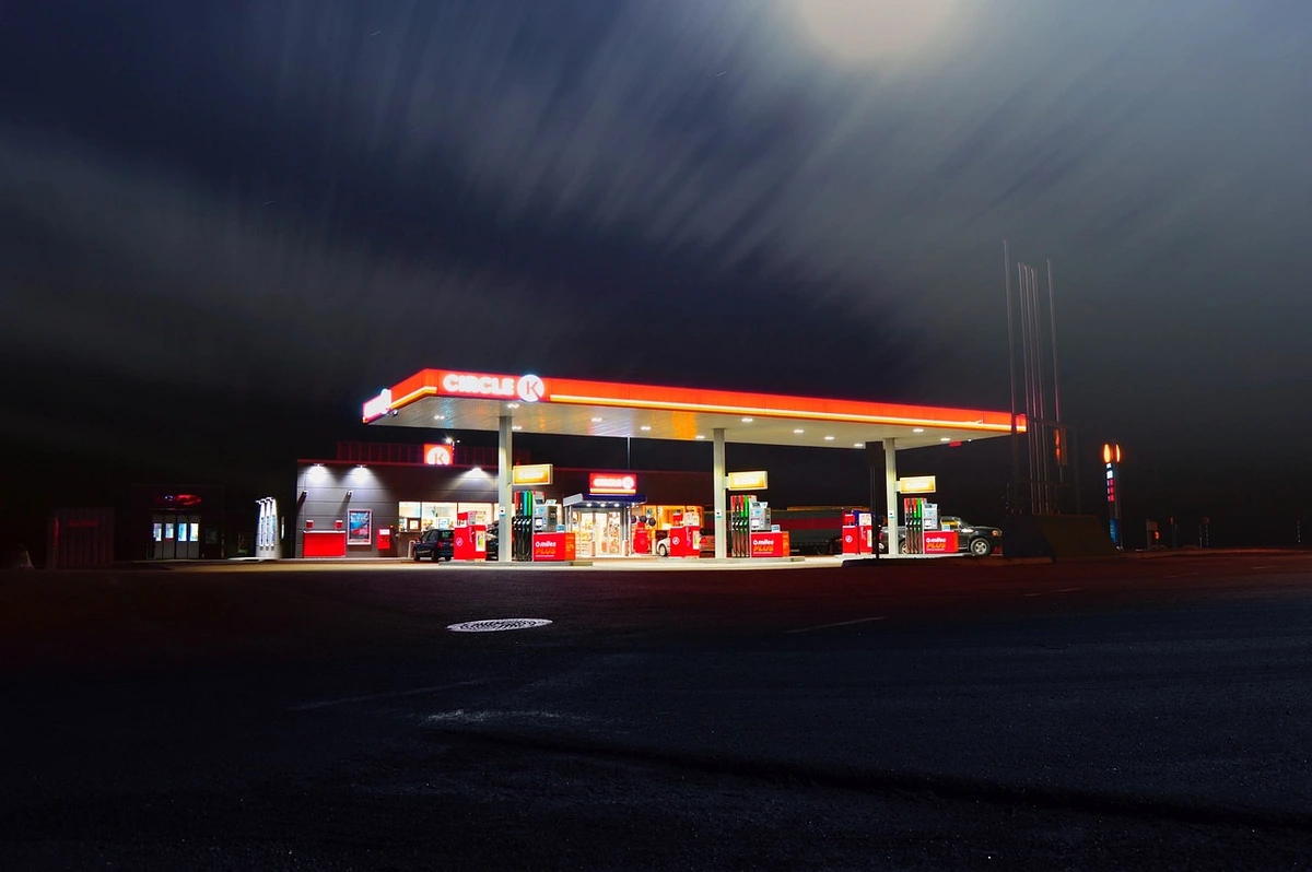 A lit up gas station at night