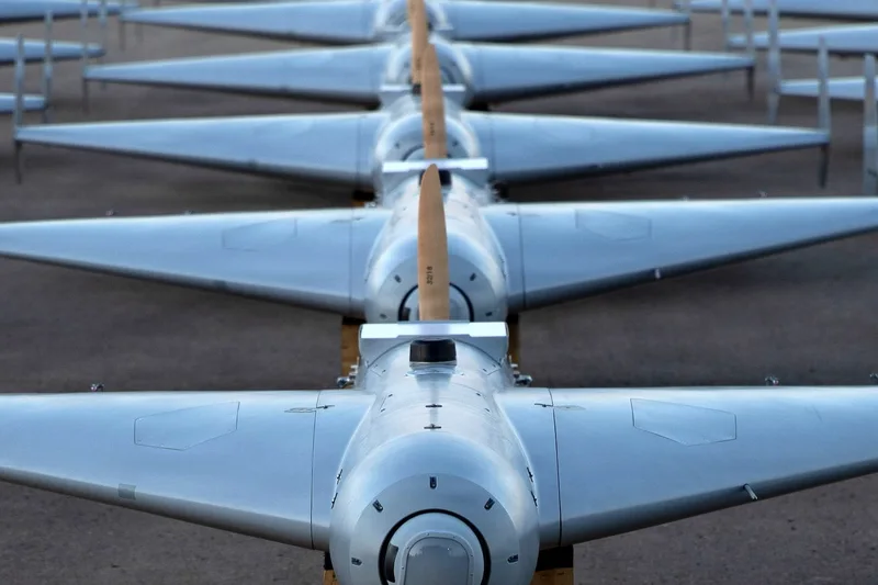 row of drones on tarmac Unmanned drones on a tarmac. Trump sons invested in drone companies
