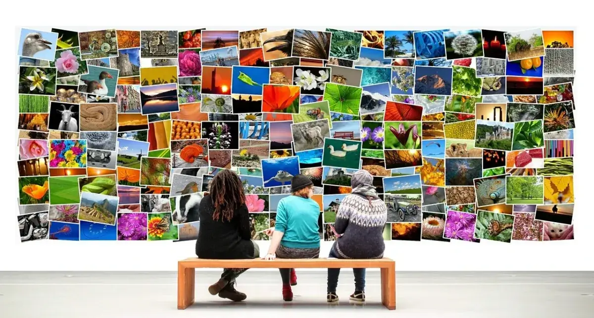 Topic hub directory. People sitting on a bench looking at a collection of images that represent topics