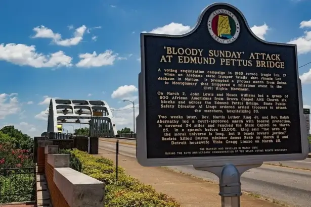 A historic marker at the Edmund Pettus Bridge in Selma, Alabama. Alabama Day if Action