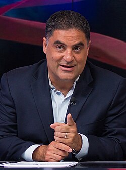 UK banned Cenk Uygur, shown here on the set of TYT