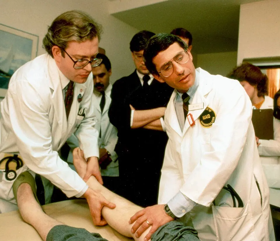 Dr. Anthony Fauci hearing ignored his contribution to AIDS. He examines an AIDS patient in this photo from 1987.
