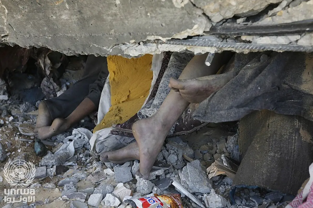 In Gaza, bare feet stick out from under the rubble of a house after an Israeli airstrike. The missing in Gaza may be under rubble or in prison.
